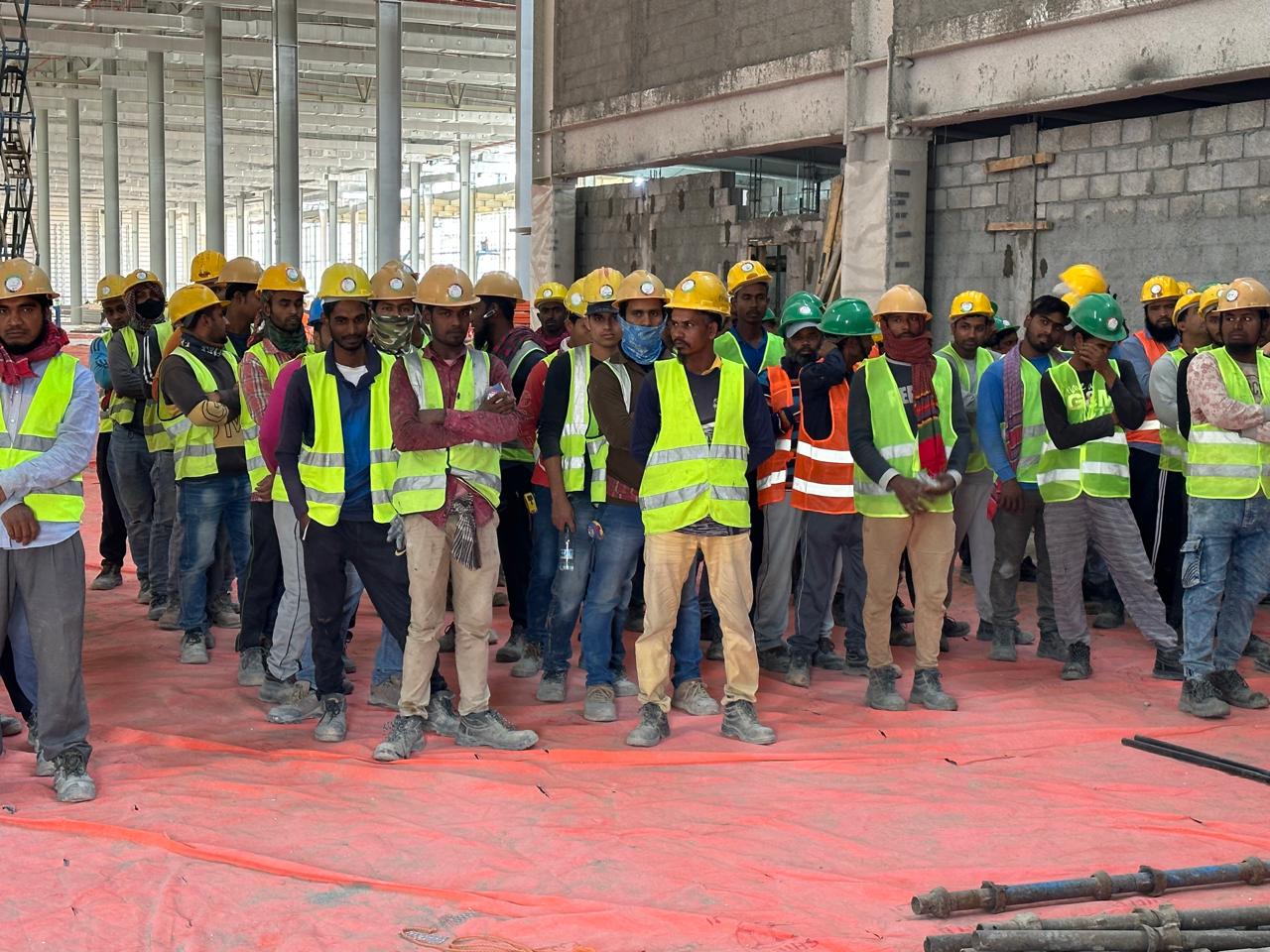 Workers handling site materials