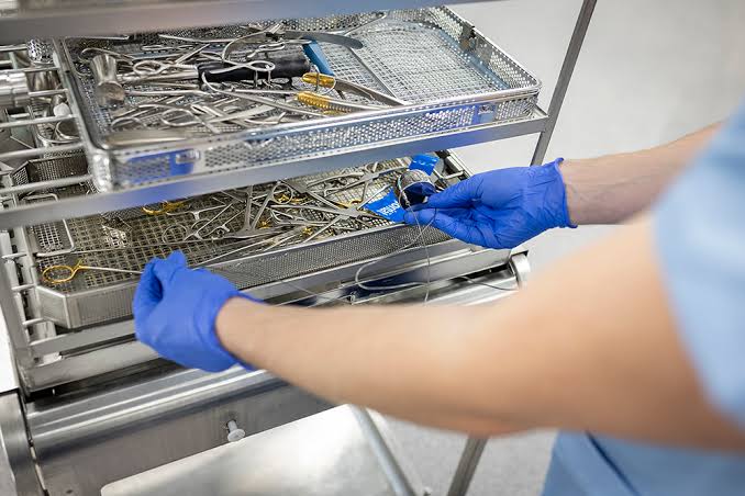 Hospital corridor being disinfected between patient transfers