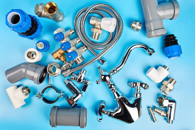 Plumber fitting a water heater